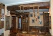 Arredamento realizzato in legno di larice antico per "Bar Osteria Lo Peyo"